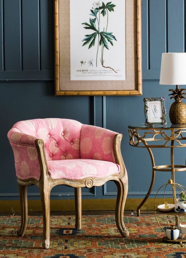 Armchair upholstered in sand color with pink patterns