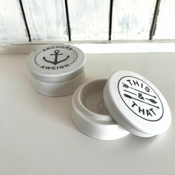 charming white ceramic nautical trinket jars feature a classic anchor design